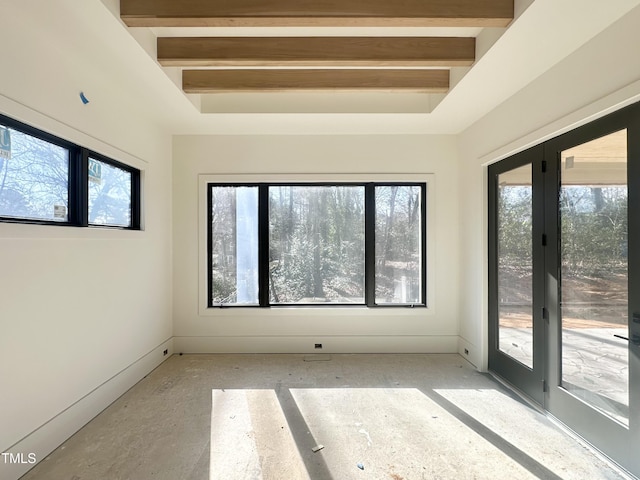 empty room with beam ceiling