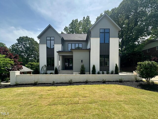 view of front of home with a front lawn