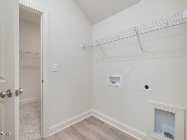 laundry room with laundry area, hookup for an electric dryer, light wood-style flooring, washer hookup, and baseboards