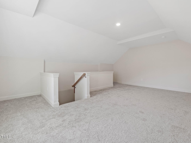 additional living space with baseboards, recessed lighting, carpet, and vaulted ceiling