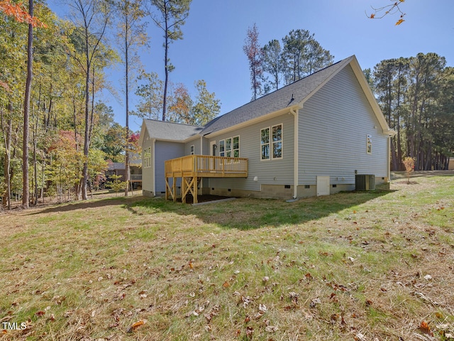 rear view of house with a lawn, a wooden deck, central AC, and crawl space