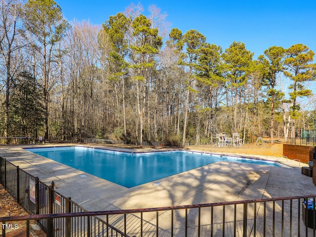 view of pool featuring a patio