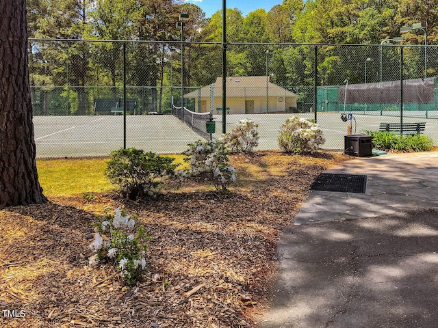 view of sport court with fence