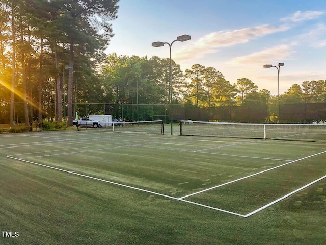 view of sport court featuring fence
