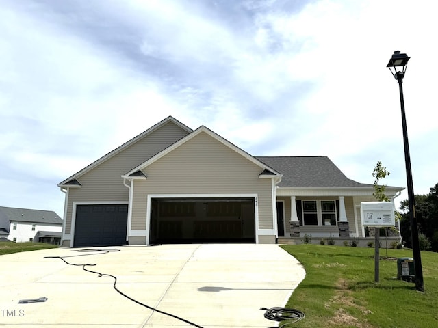 view of front facade with a garage and a front lawn