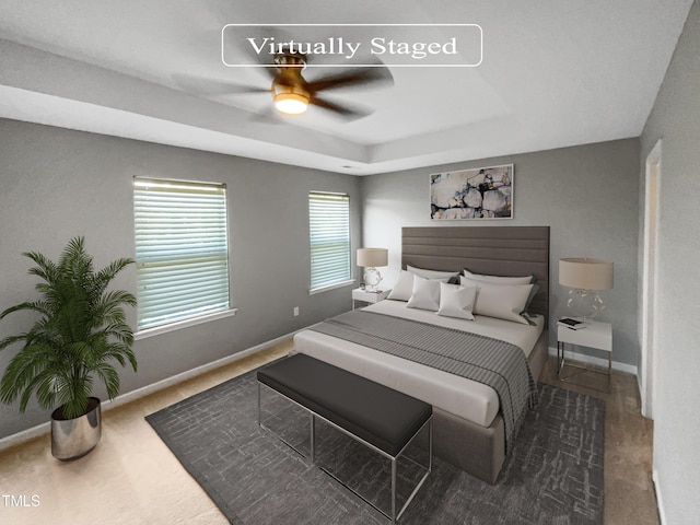 carpeted bedroom featuring ceiling fan