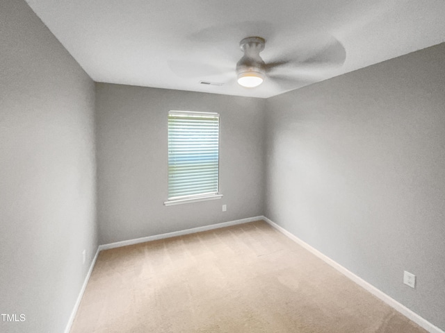 carpeted empty room with ceiling fan