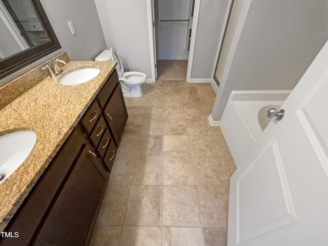 full bathroom featuring vanity, shower with separate bathtub, and toilet