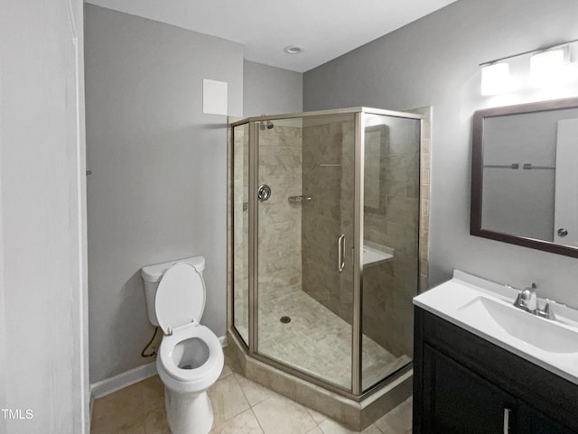 bathroom featuring walk in shower, tile patterned floors, vanity, and toilet