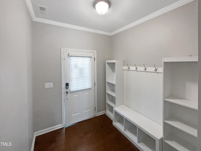 mudroom featuring ornamental molding and dark carpet