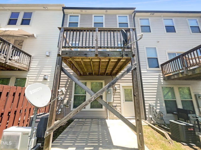 back of property featuring central air condition unit