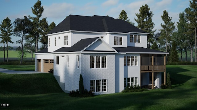 back of house featuring a garage, a sunroom, and a yard