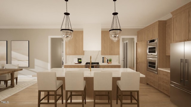 kitchen with stainless steel appliances, hanging light fixtures, a center island with sink, and wall chimney range hood