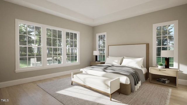 bedroom with light hardwood / wood-style flooring