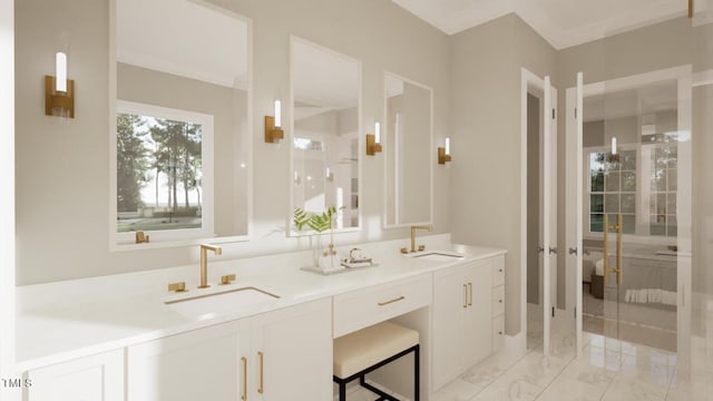 bathroom with ornamental molding and vanity