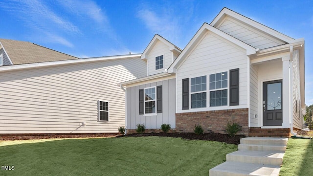 view of front of home with a front yard