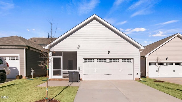 view of front of home with a front yard and central AC