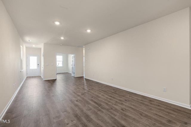 unfurnished room with dark hardwood / wood-style floors