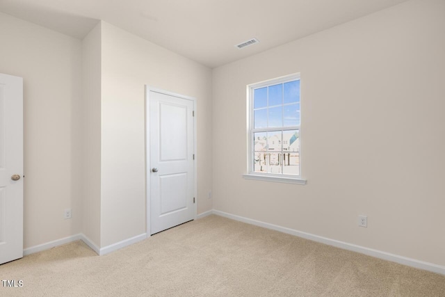 unfurnished bedroom featuring light colored carpet