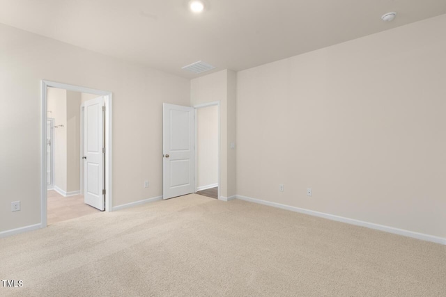 unfurnished bedroom featuring light colored carpet