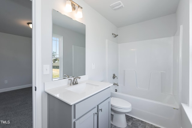 full bathroom featuring washtub / shower combination, vanity, and toilet