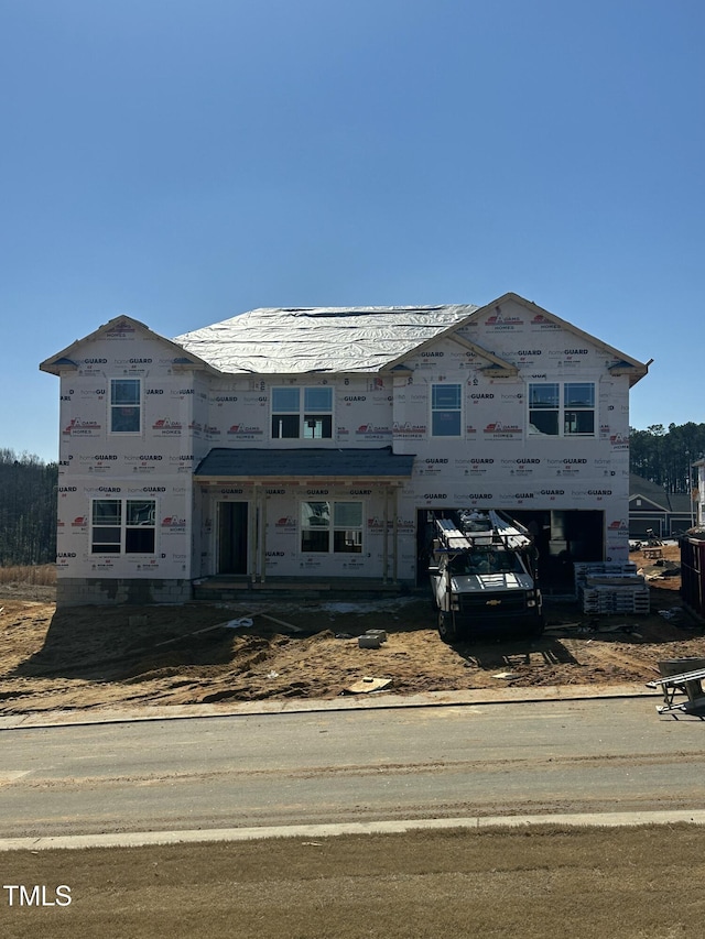 property in mid-construction with a garage