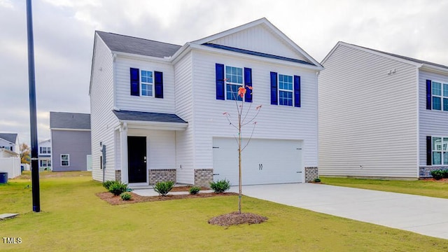 view of front of home with a garage and a front yard