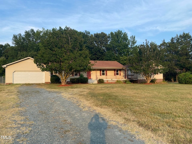 ranch-style home with a front lawn and covered porch