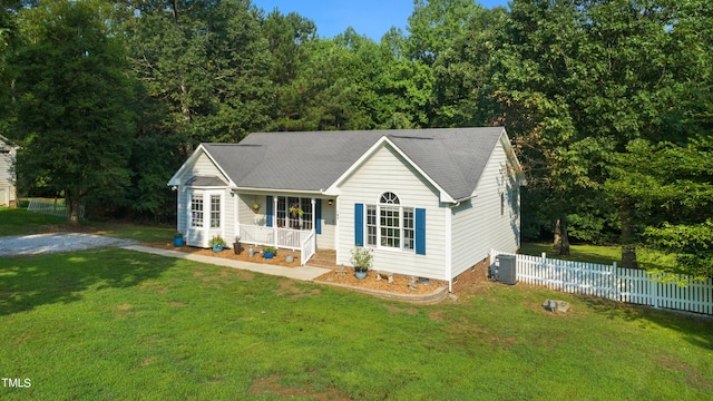 ranch-style house featuring central AC, a porch, and a front yard