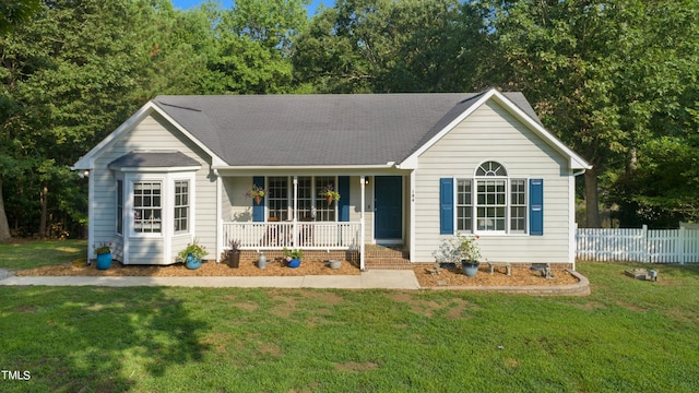 ranch-style house featuring a front yard and a porch