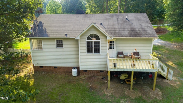 back of house featuring a deck