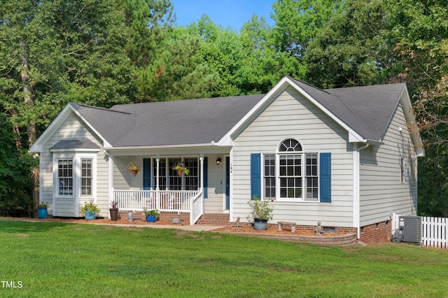 ranch-style home with central AC, a front lawn, and a porch