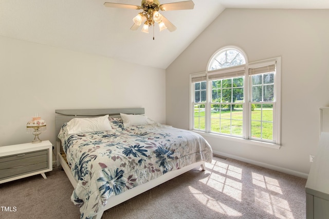 bedroom featuring vaulted ceiling, ceiling fan, and carpet flooring