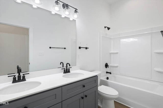 full bathroom with vanity, tub / shower combination, and toilet