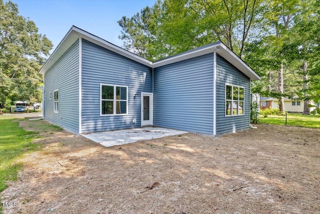 rear view of house featuring a patio