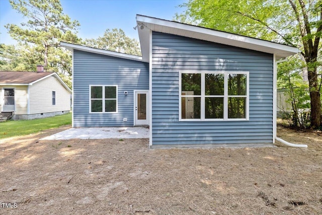 back of property featuring a patio