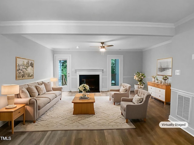 1432 Quarter Pt, Raleigh, NC 27615 - living room with healthy amount of natural light, wood finished floors, ceiling fan, and ornamental molding