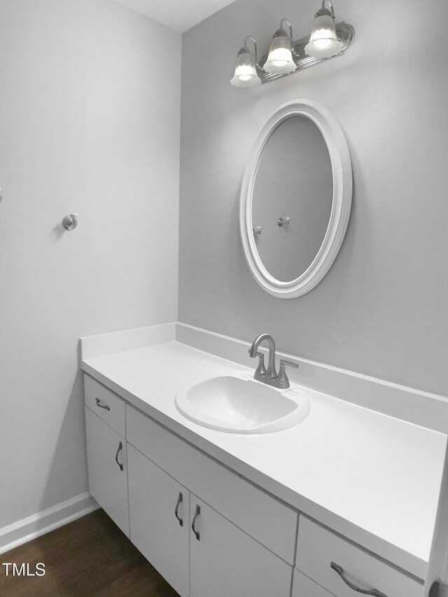 1432 Quarter Pt, Raleigh, NC 27615 - bathroom with vanity and wood finished floors