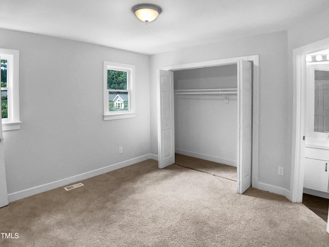1432 Quarter Pt, Raleigh, NC 27615 - unfurnished bedroom featuring carpet floors and a closet