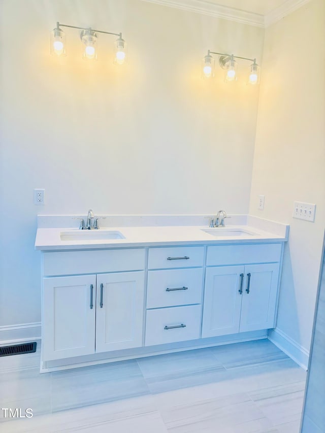 bathroom featuring vanity and ornamental molding