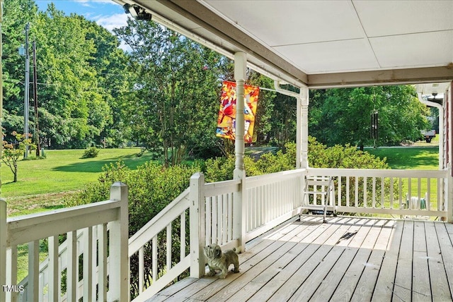 wooden deck with a lawn