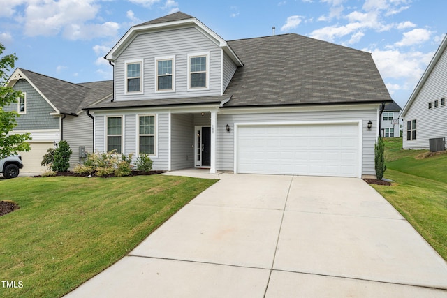 view of front facade with a front yard and a garage