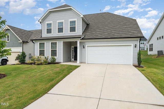 view of front of house featuring a garage, a front yard, and central air condition unit