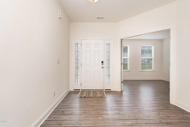 entryway with dark wood-type flooring