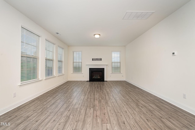 unfurnished living room featuring light hardwood / wood-style flooring