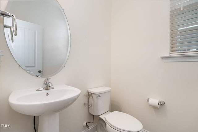 bathroom with toilet and sink