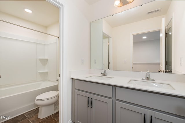 full bathroom featuring vanity, toilet, and shower / washtub combination