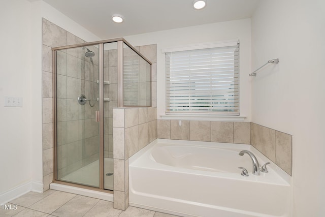 bathroom with tile patterned flooring and plus walk in shower