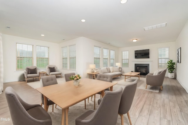 dining space featuring light wood-type flooring