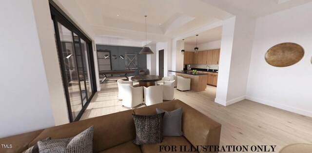 living room featuring light wood-style floors, baseboards, and a raised ceiling